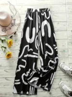 Pantalones de pierna ancha con estampado abstracto - Imagen 5